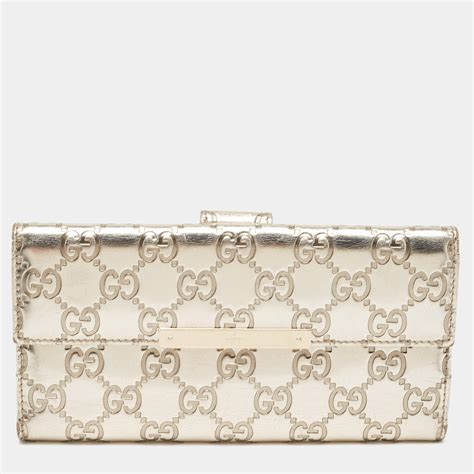 gucci travel metallic golden beige bag wallet|Gucci guccissima wallet.